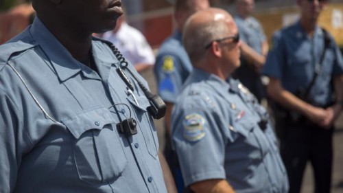 Ferguson police officers at an August 2014 rally.