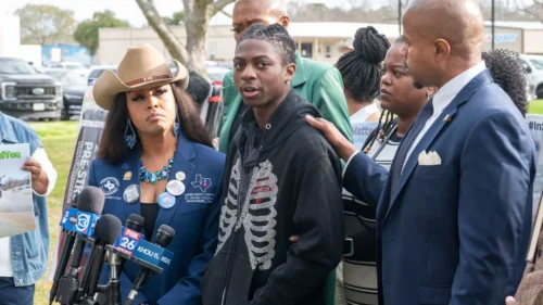 Dr. Candice Matthews, left, listens as Darryl George, center, makes comments before a hearing regarding George's punishment for violating school dress code policy because of his hair style, on February 22, 2024, at the Chambers County Courthouse. 
(Kirk Sides/Houston Chronicle/Getty Images)