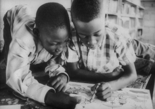 two boys coloring