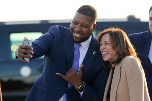 Durham, North Carolina, Mayor Leonardo Williams (left) takes a selfie with Democratic presidential nominee Vice President Kamala Harris as she arrives at Raleigh-Durham International Airport in Morrisville on Saturday.
Steve Helber via Associated Press