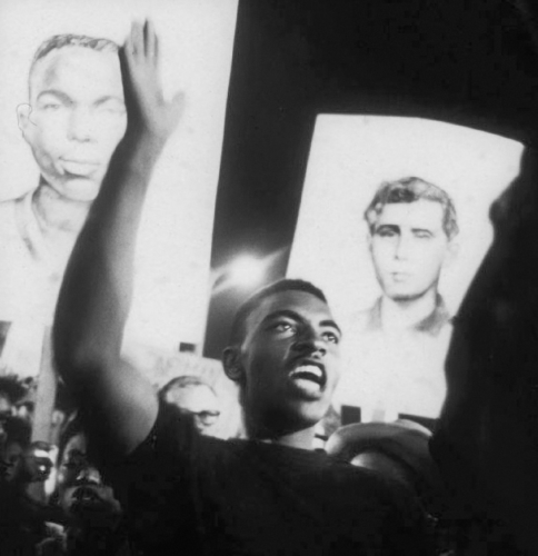 Young man at night time rally